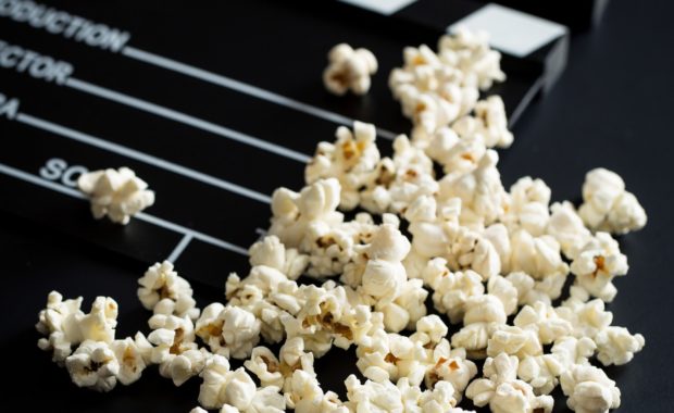 Clapperboard and popcorn.