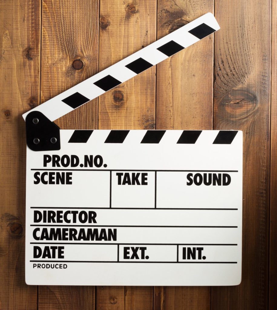 movie clapper board at wooden background